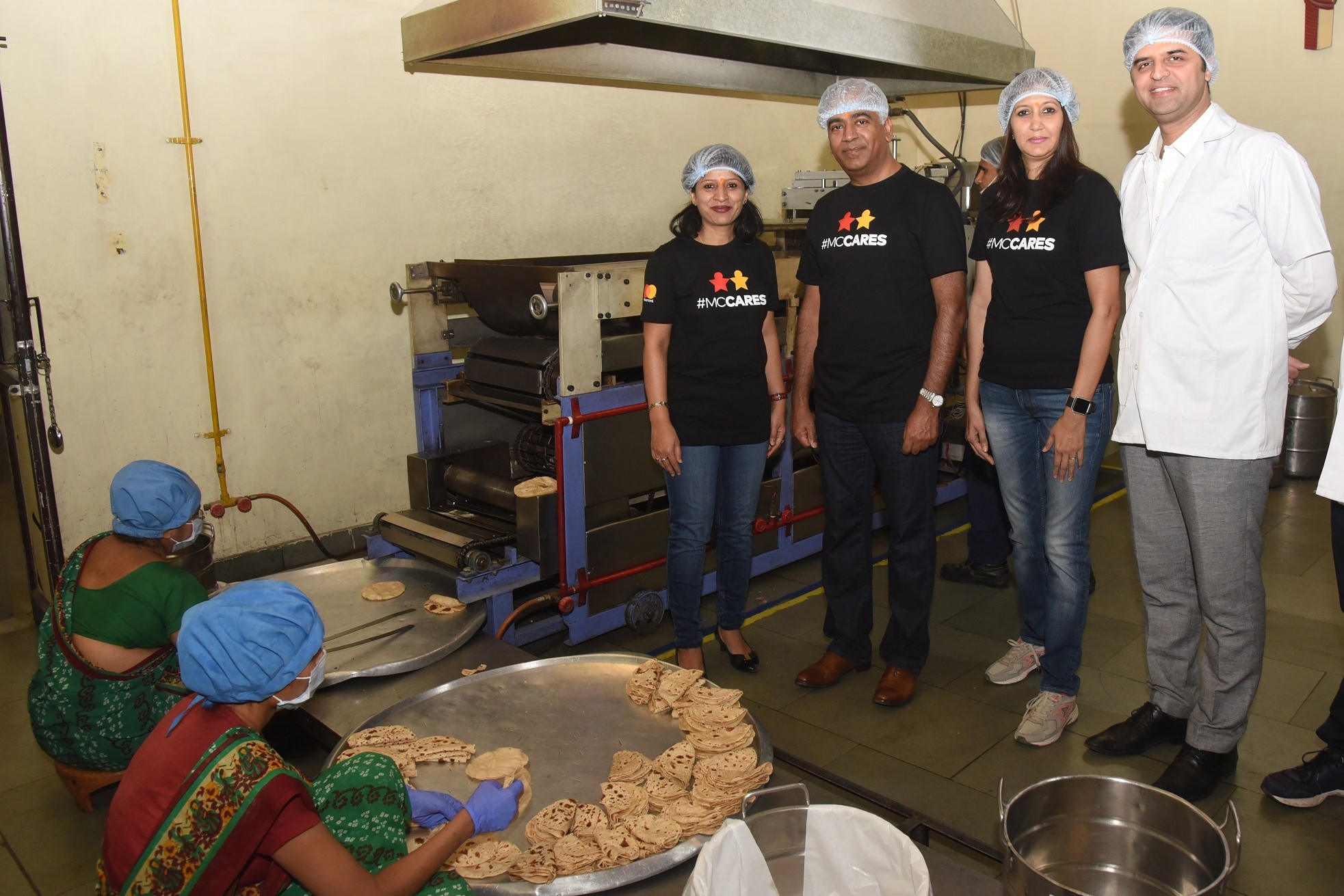 (From Left to Right) Farhin Kharawala, Vice President, Software Engineering, Mastercard; Deepak Mahbubani, Executive Vice President, Global Tech Hubs, Mastercard; Sonali Mungale, Director, Human Resources Business Partner, Mastercard; and Sundeep Talwar, CMO, The Akshaya Patra Foundation at the Akshaya Patra Kitchen in Vadodara