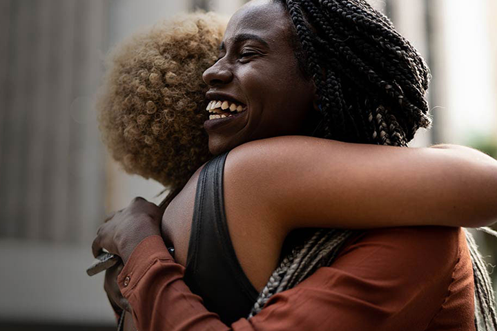 Two women hugging. 