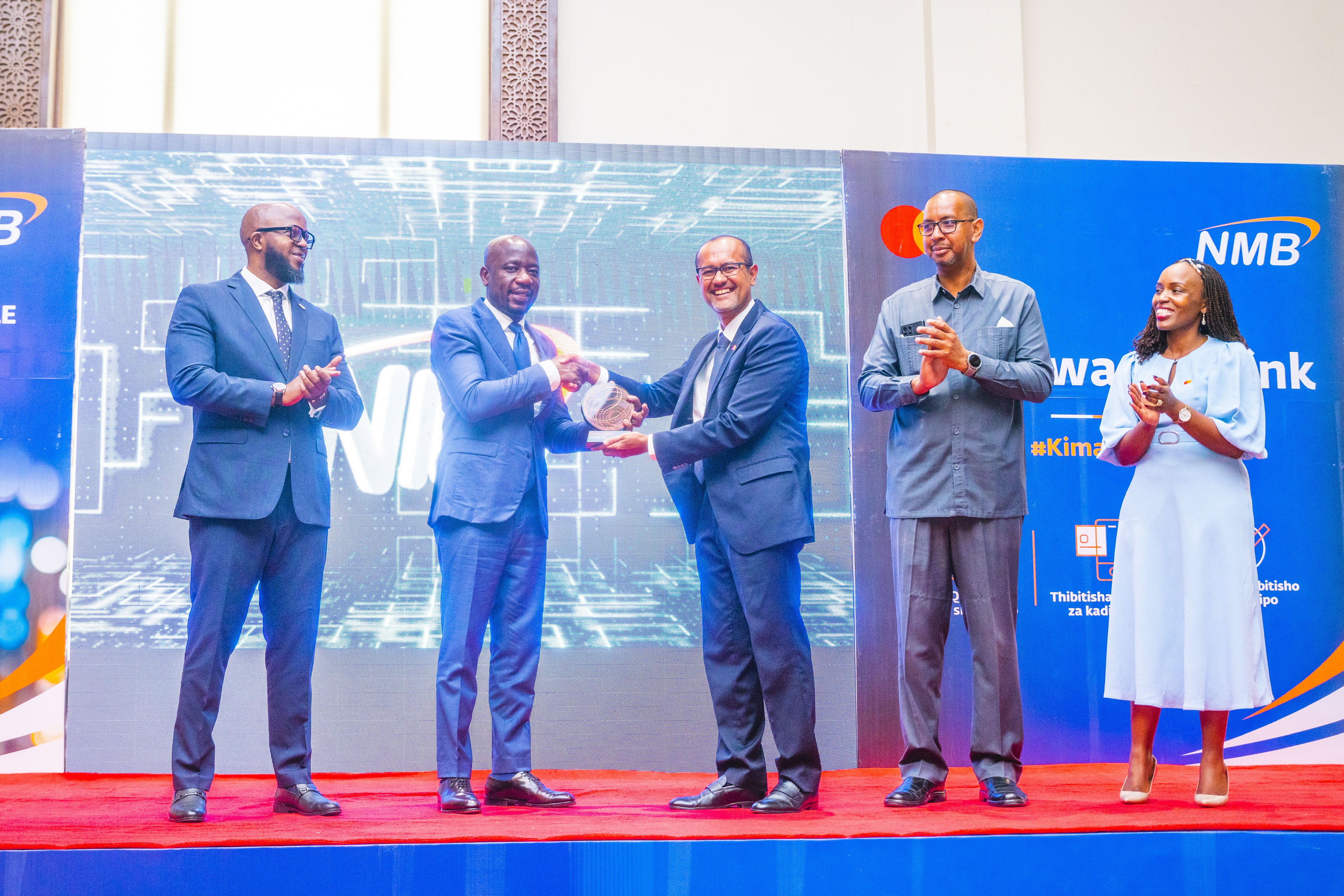 (L-R): Philbert Casmir, Head of Card Business at NMB Bank Plc; Filbert Mponzi, Chief of Retail Banking at NMB Bank Plc; Shehryar Ali, Senior Vice President and Country Manager for East Africa and Indian Ocean Islands at Mastercard; Dr. Aboud Suleiman Jumbe, Principal Secretary for Zanzibar’s Ministry of Tourism and Heritage; and Elsie Wachira-Kaguru, Director, Account Management for East Africa at Mastercard during the launch of their QR Pay by Link payment solution with Click 2 Pay, the first of its kind in Africa.