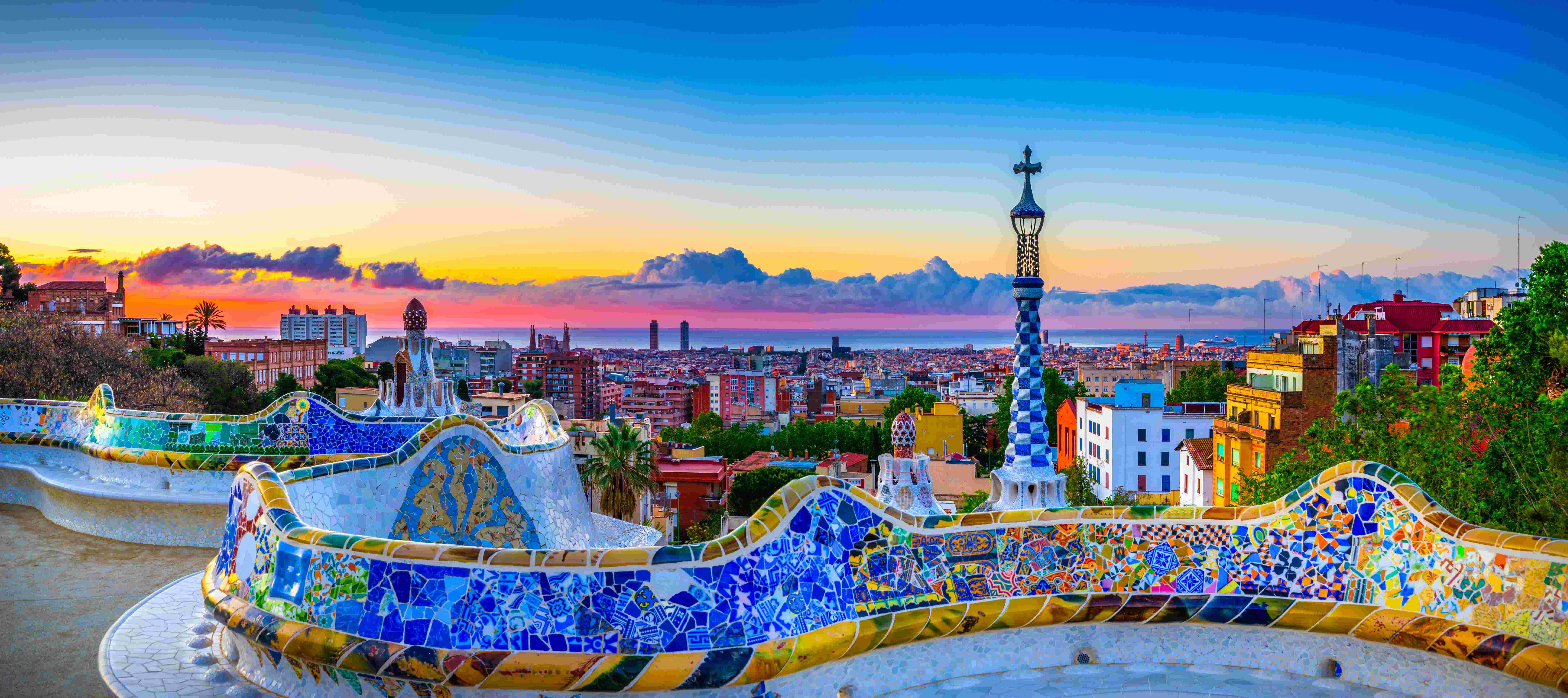 A view of Barcelona as seen from a Gaudi-built overlook at sunset.