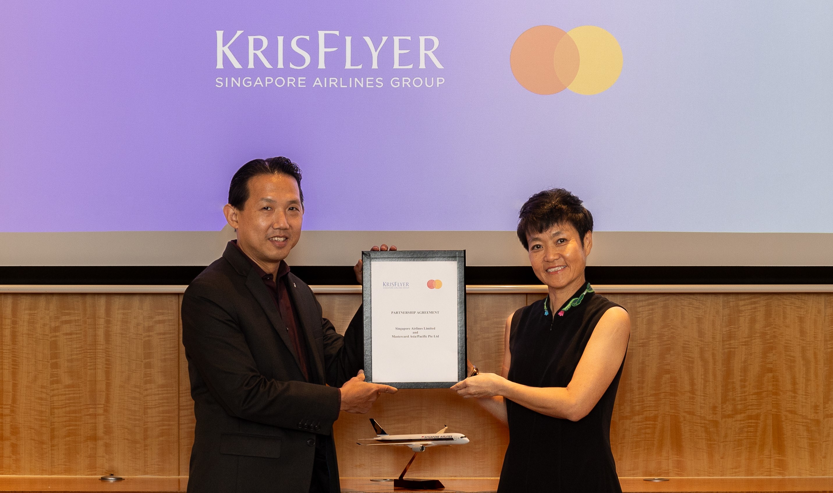 Mr Ryan Pua (left), Divisional Vice President Loyalty Marketing, Singapore Airlines, with Ms Deborah Heng (right), Mastercard’s Country Manager for Singapore, announcing the strategic partnership between Mastercard and Singapore Airlines to enrich travel experiences for cardholders.