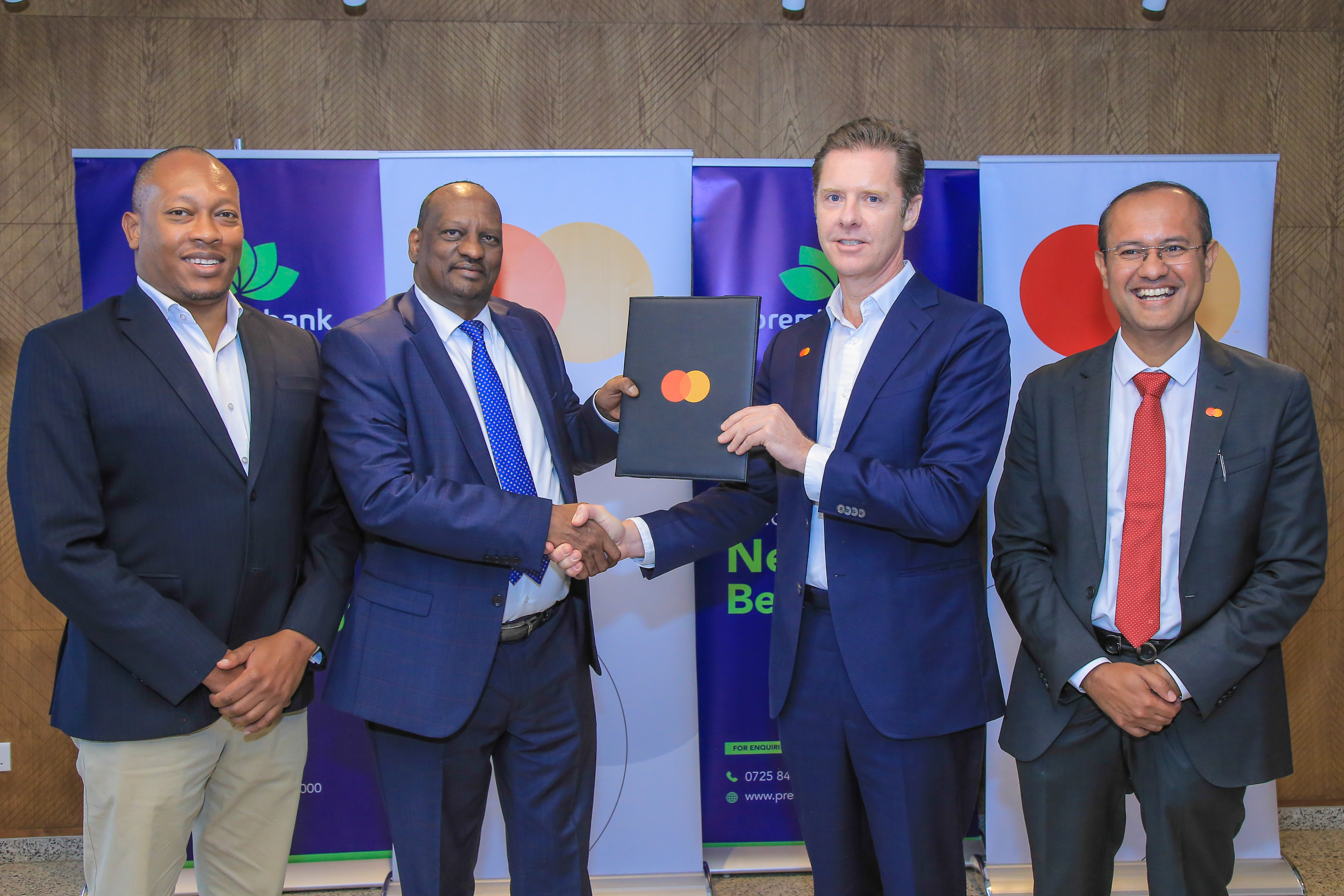 (L-R): Tengeri Osoro, Director Premier Bank Kenya, Osman Dualle, CEO of Premier Bank Kenya and Mark Elliott, Division President for Africa at Mastercard and Shehryar Ali, SVP and Country Manager for East Africa and Indian Ocean Islands during the signing of the collaboration agreement that will introduce Shari'ah-compliant payment solutions in Kenya.